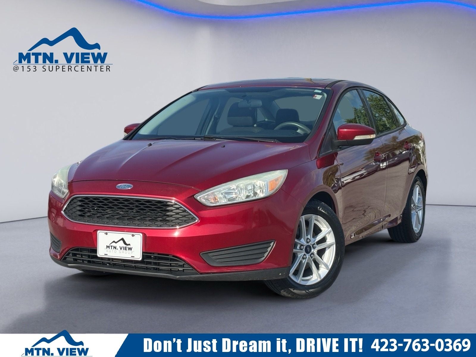 2015 Ford Focus SE in Ruby Red Metallic — front three-quarter view