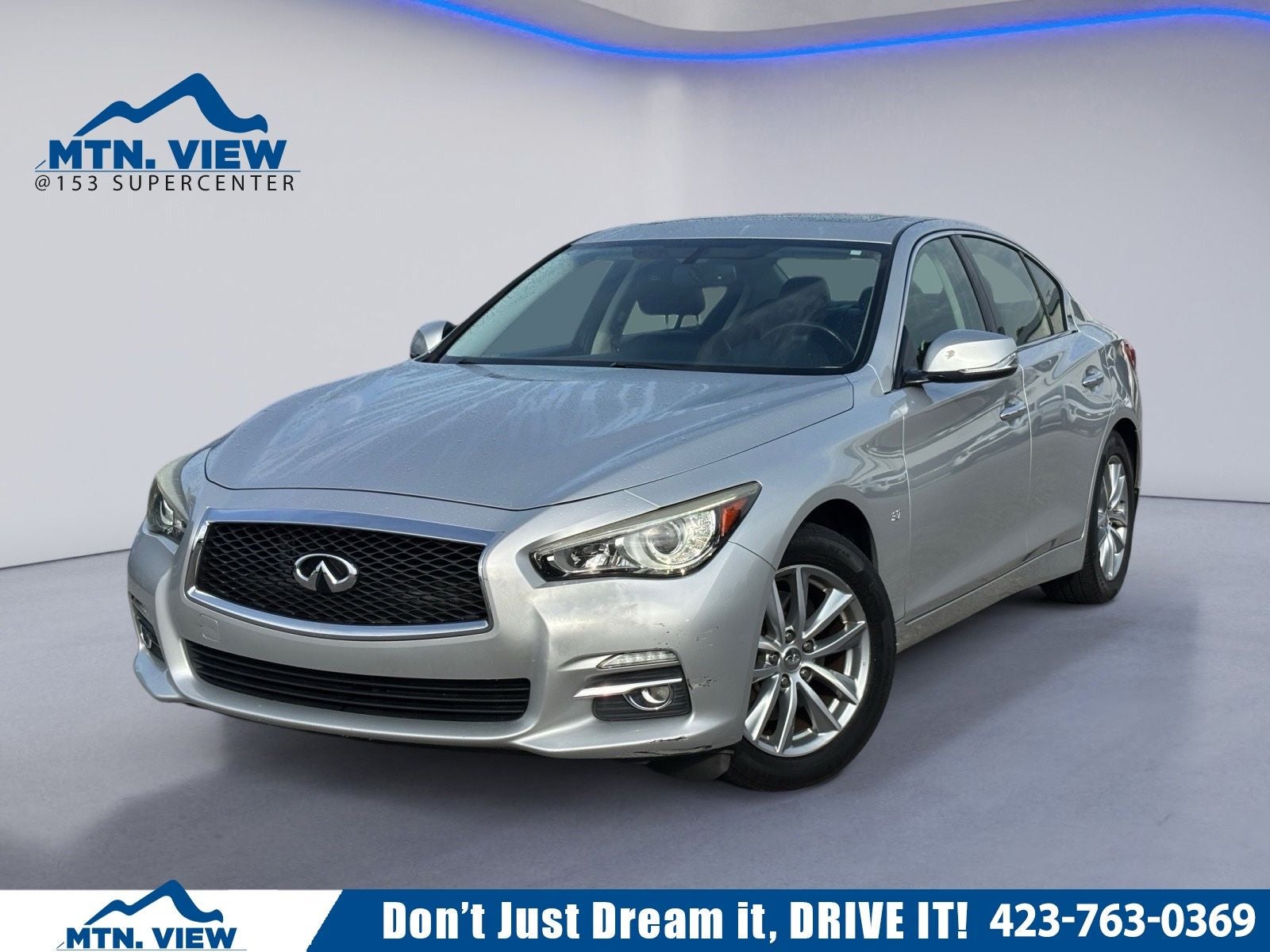 2015 INFINITI Q50 Premium in Liquid Platinum — front three-quarter view