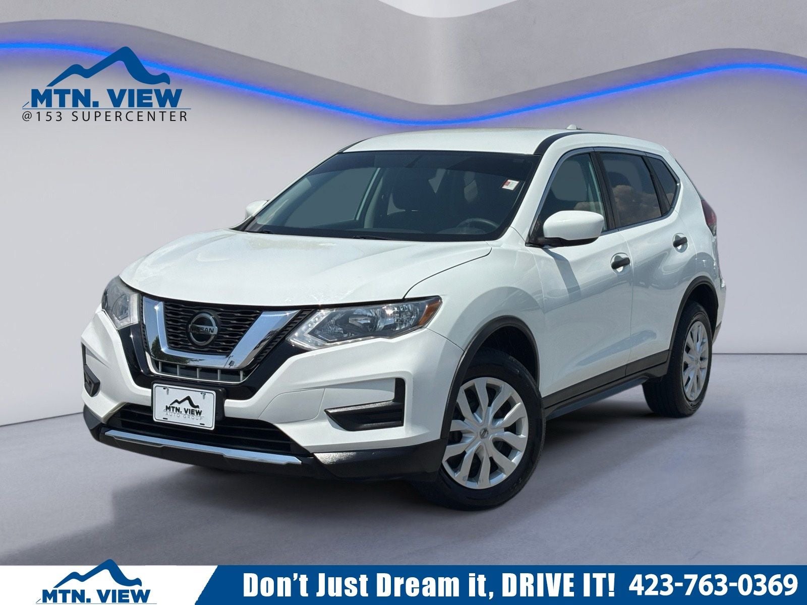 2018 Nissan Rogue S in Glacier White — front three-quarter view