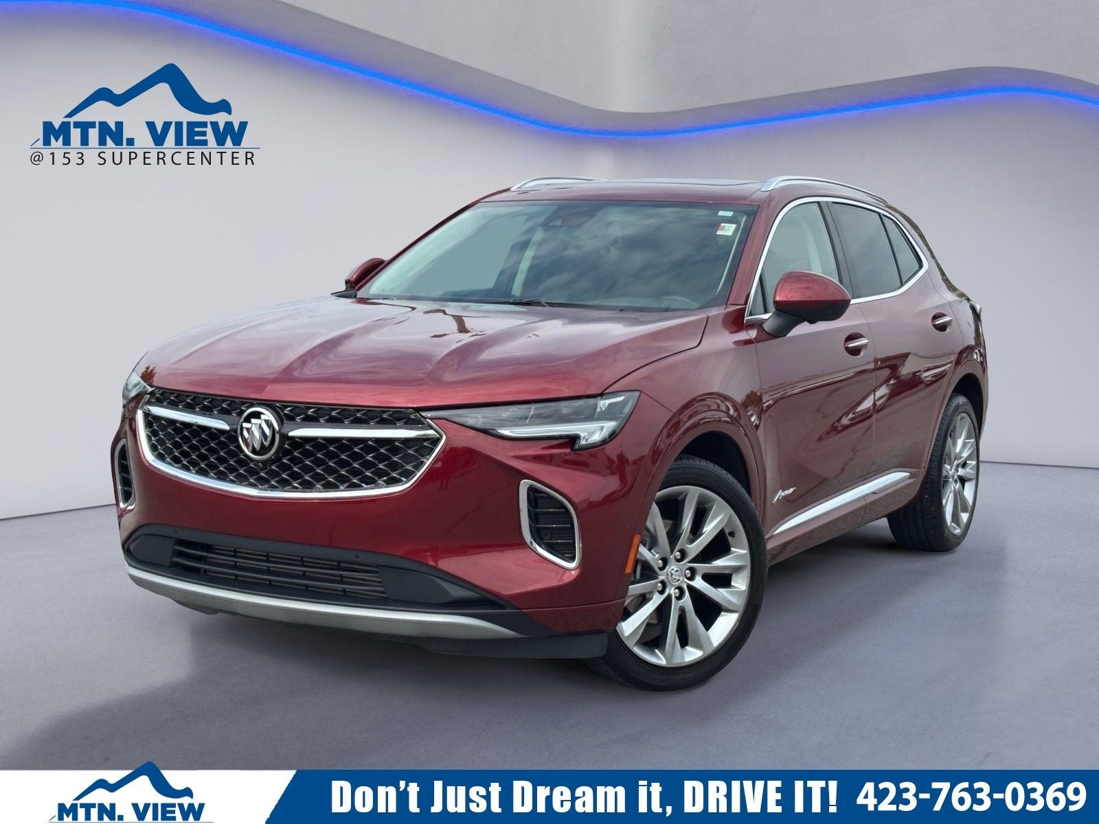 2023 Buick Envision Avenir in Cinnabar Metallic — front three-quarter view